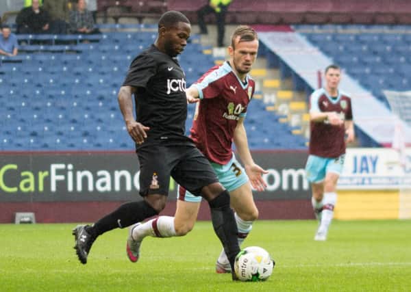 Cameron Dummigan tries to win the ball in a pre-season fixture against Bradford City