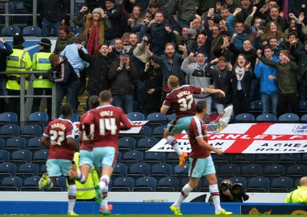 Scott Arfield (second left) celebrates in front of the Burnley fans after scoring at Ewood Park