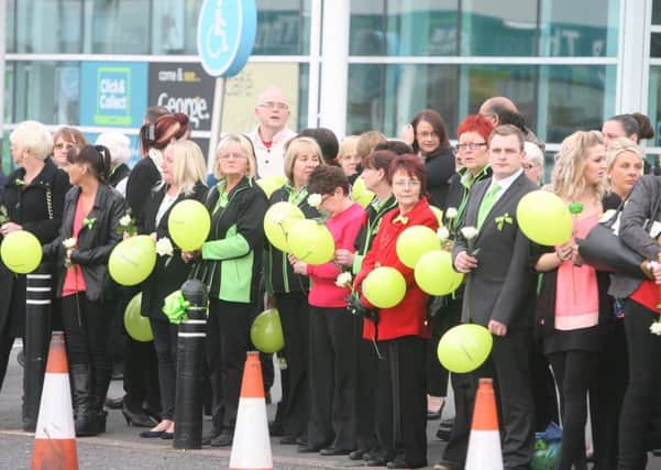 ASDA staff members line-up for the funeral cortege of their colleague Michelle Holmes.