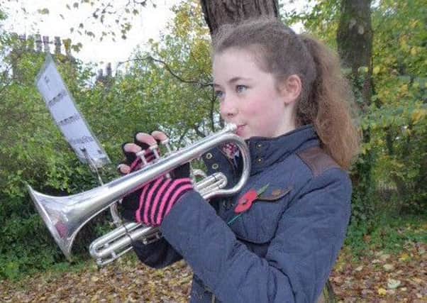 Hattie Nuttall from Colne plays the Last Post at the town's Remembrance Sunday service (s)