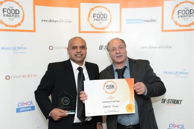 Ishrat Mehdi and Edward Cook of Santa's Pizza collect Takeaway of the Year award.