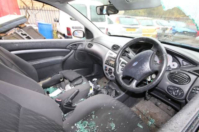 The damage inside a Ford Focus at Southfield Garage.