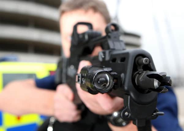 A members of the Greater Manchester Police armed response unit.  Photo: Martin Rickett/PA Wire