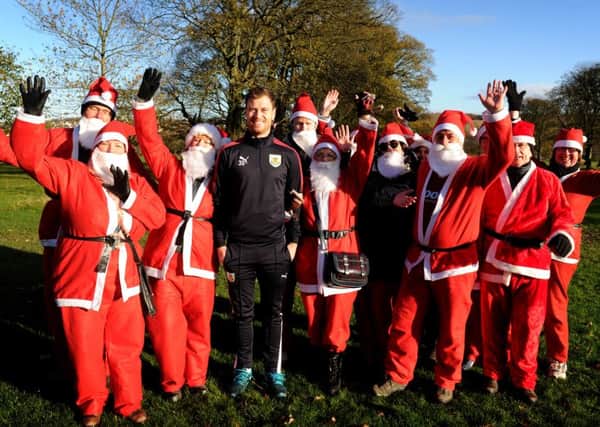 Burnley FC star Ashley Barnes started and joined in a Santa Dash at Towneley Park