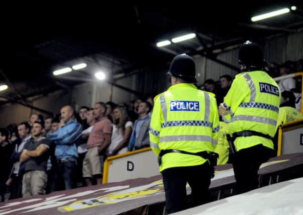 Police keep a close eye on away fans at Turf Moor