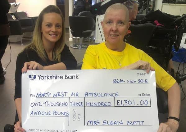 GONE TOMORROW: Leanne Cottam and Susan Pratt with the cheque for the North west Air Ambulance