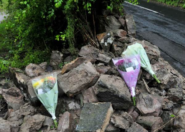 Photo: David Hurst Flowers laid at the scene of a fatal car crash on Low Road.