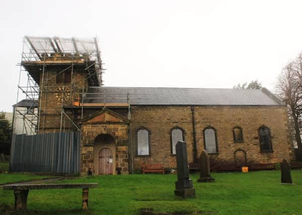 The historic St Mary's Church in Newchurch-in-Pendle, with work taking place on the tower roof.
