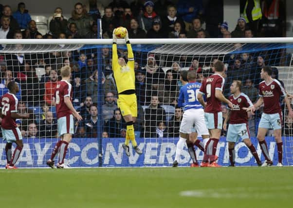 Tom Heaton claims a high ball at QPR on Saturday