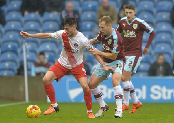 Scott Arfield battles for the ball with Charltons Johnnie Jackson