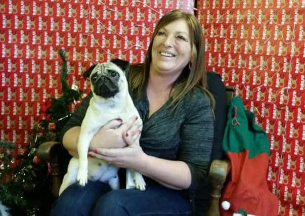 Marie Ling from Norwich is reunited with her pet pug Nellie who was found roaming the streets of Burnley 221 miles away from home. (S)
