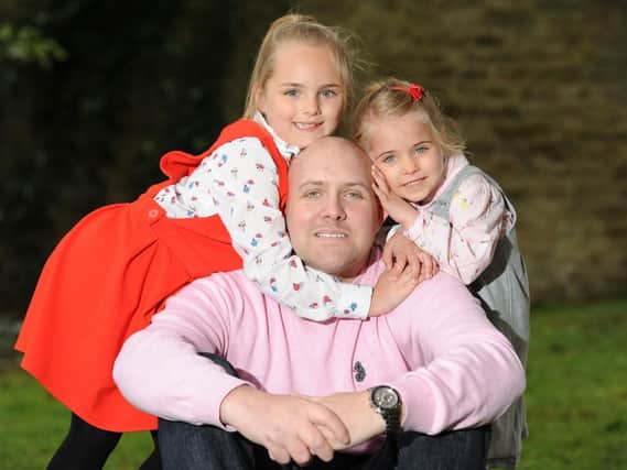 Tom Cooper with daughters Tienna (7) and Tiani (4)