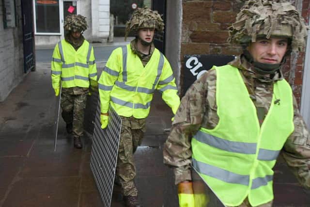 The Army has been called in to support efforts to protect flood-hit areas of Cumbria amid fears that more heavy rain will fall on Christmas Day.
People are set to spend the day putting out sandbags in preparation and flood defence gates have been closed in Cockermouth, Carlisle and Keswick.
Cumbria has suffered severe flooding three times this month. 
The Ministry of Defence said one company from 2nd Battalion Duke of Lancaster's Regiment (2LANCS), based at Weeton Barracks near Preston, are being deployed to affected areas on Christmas Day morning.
Rain will spread across Wales and northern England through the course of Christmas Day, reaching southern parts of Scotland during the early hours of Boxing Day, with prolonged spells forecast for south Cumbria.
The county has already recorded the wettest December since records began in 1910.
Defence Secretary Michael Fallon said: "Even at Christmas our Armed Forces are keeping us safe. Once again they are responding to the Cumbria floods with a level of commitment