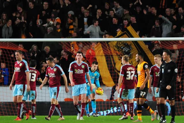 Burnley players react after Hull City's Abel Hernandez scored his sides second goal