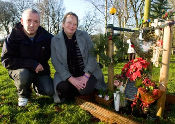 Penny and John Clough with the tree that has been planted in memory of their daughter Jane at Barrowford Cemetery.