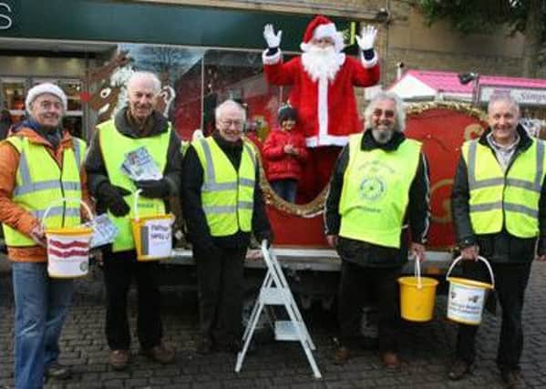 Padiahm Rotary. sleigh collection: From left, Rtns. David Foley, Barry Brown, Anthony Briggs, Father Christmas,  Alan Ravenscroft and Paul Wright (S)