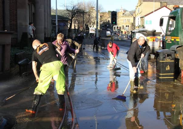 Padiham Clean-up after the flood as local residents and volunteers helped each other to clean up the mess caused by the floods in the main street of Padiham.
27th December 2015