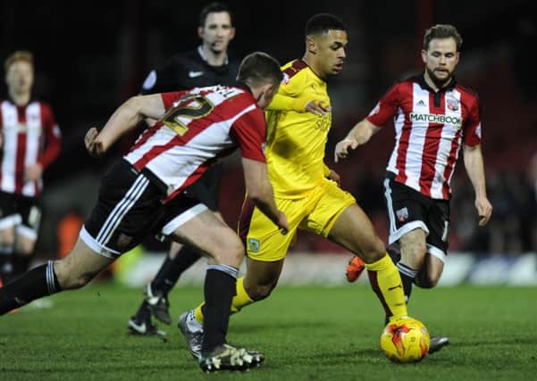 Clarets striker Andre Gray and former team-mate Alan Judge (right) in action at Griffin Park