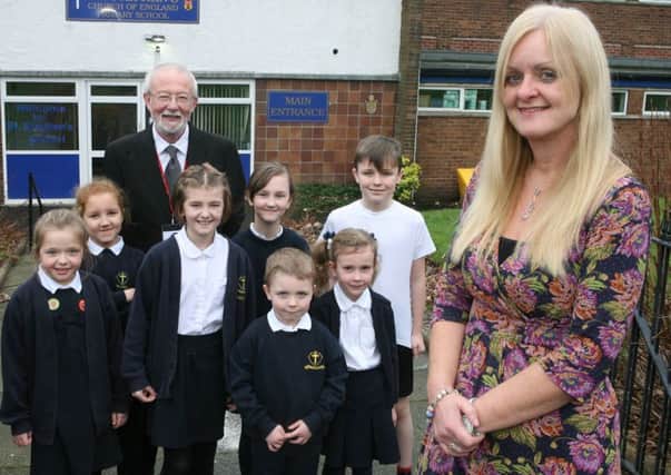 Mrs Sue Cornwell who is the new headteacher at St Stephen's Cof E Primary School with chair of govenors Philip Lombard and pupils.