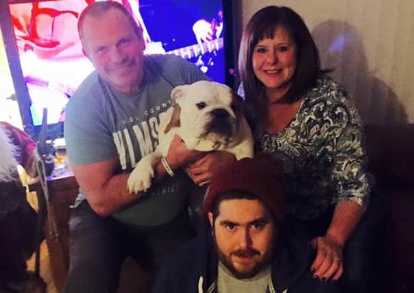 Ben King with mum and dad Fiona and Dave and the family's pet bulldog Bubba. (S)