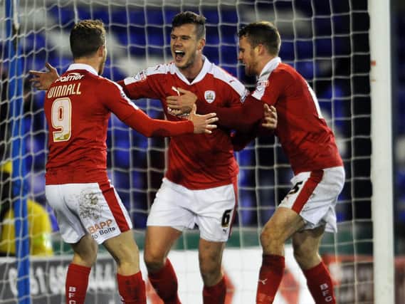 Kevin Long (centre) has extended his stay at Barnsley