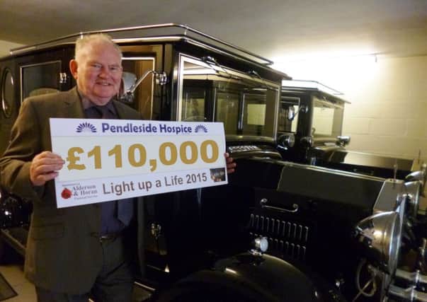 John Horan, one of the owners of Alderson and Horan Funeral Services, with a cheque for the Â£110,000 raised from the Pendleside Hospice Light up a Life appeal for which the business sponsored. (S)