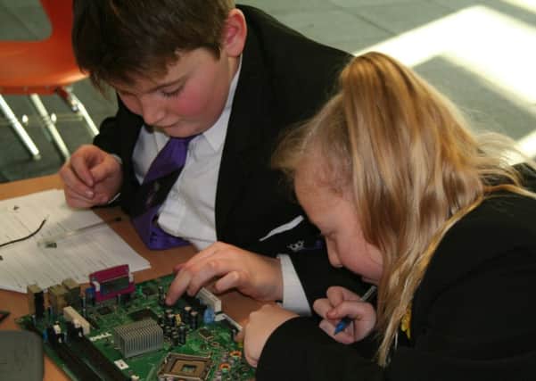 Fraser Bannister (left) and Freya Gore working on their project.