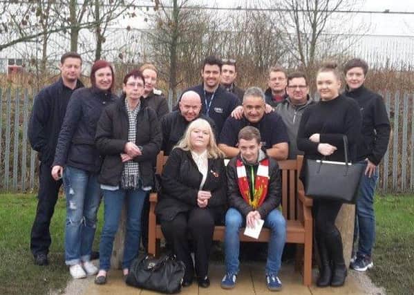 Family, friends and colleagues of John Dodgson at the memorial bench