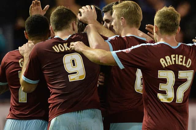 The Clarets celebrate the opening goal