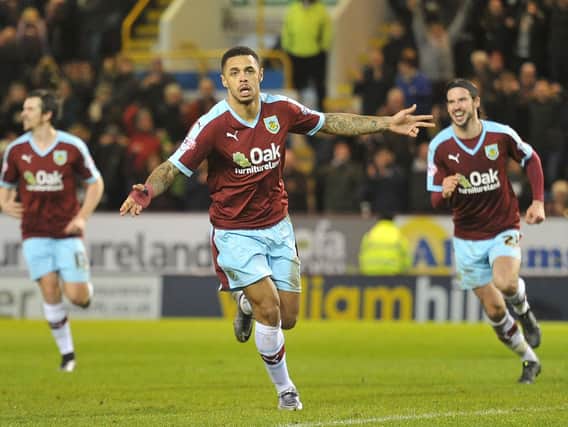 Andre Gray turns to celebrate after putting the Clarets back in front from the penalty spot.