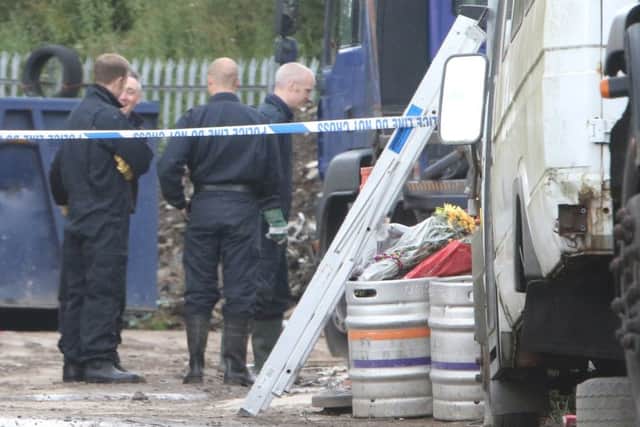 Police at the scene at Pendle Skip Hire last summer