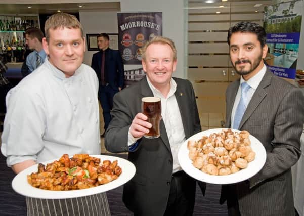 Holiday Inn  Express chef Lee Hourihan with Moorhouse's managing director David Grant and the hotel's general manager Gerardo Souto (s)