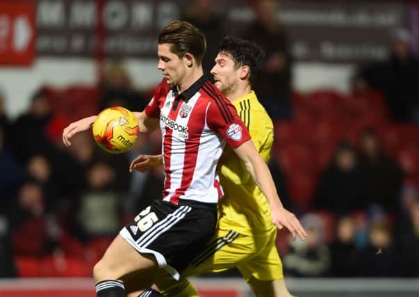 James Tarkowski (left) and Middlesbrough's David Nugent battle for the ball during the Sky Bet Championship match at Griffin Park, London. PRESS ASSOCIATION Photo. Picture date: Tuesday January 12, 2016. See PA story SOCCER Brentford. Photo credit should read: Daniel Hambury/PA Wire. RESTRICTIONS: EDITORIAL USE ONLY No use with unauthorised audio, video, data, fixture lists, club/league logos or "live" services. Online in-match use limited to 75 images, no video emulation. No use in betting, games or single club/league/player publications.