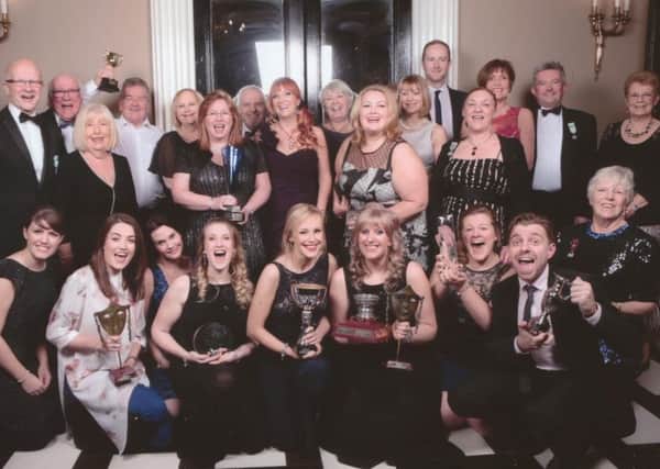Delighted members of Burnley Light Opera Society celebrate their successes. (s)