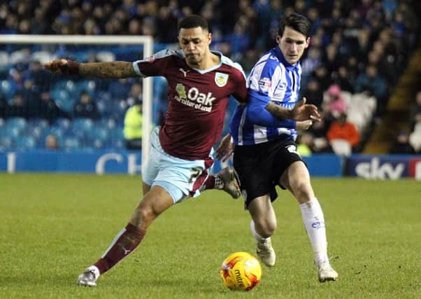 Andre Gray battles with Sheffield Wednesday's Kieran Lee
