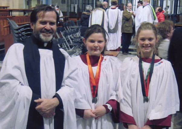 Archdeacon of Lancaster, the Venerable Michael Everitt, with Higham choiristers Francesca Gilbert (l) and  Elizabeth Saunders (S)