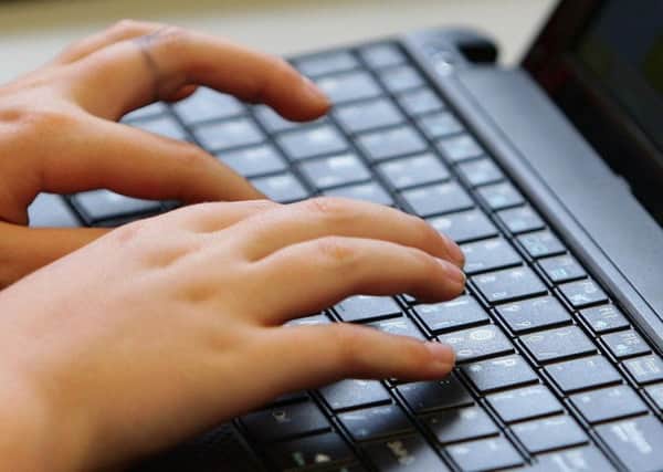 A young person using a laptop. Photo: Dave Thompson/PA Wire