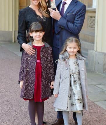 Bowler James Anderson at Buckingham Palace, London, with wife Daniella and daughters Lola and Ruby (right), after he was made an OBE (Officer of the Order of the British Empire) by the Prince of Wales for services to cricket.
