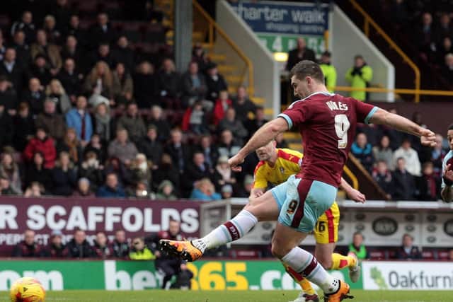 Sam Vokes strokes home from the spot to give the Clarets the lead