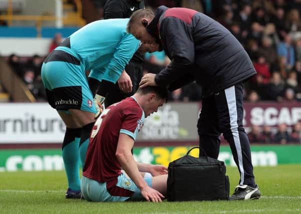 Burnley's Michael Keane receives treatment for a head injury during the first halfPhotographer David Shipman/CameraSportFootball - The Football League Sky Bet Championship - Burnley v Rotherham United - Saturday 20th February 2016 - Turf Moor Â© CameraSport - 43 Linden Ave. Countesthorpe. Leicester. England. LE8 5PG - Tel: +44 (0) 116 277 4147 - admin@camerasport.com - www.camerasport.com