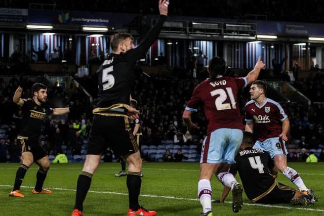 George Boyd turns to celebrate with scorer Sam Vokes