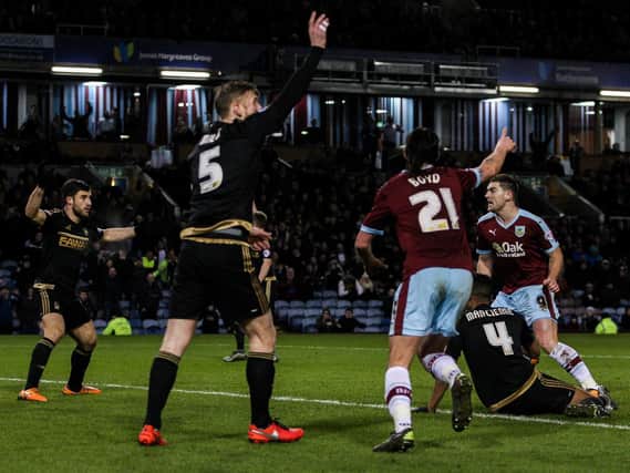 George Boyd turns to celebrate with scorer Sam Vokes