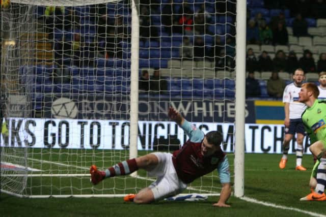 Sam Vokes slides in to put Burnley into the lead.