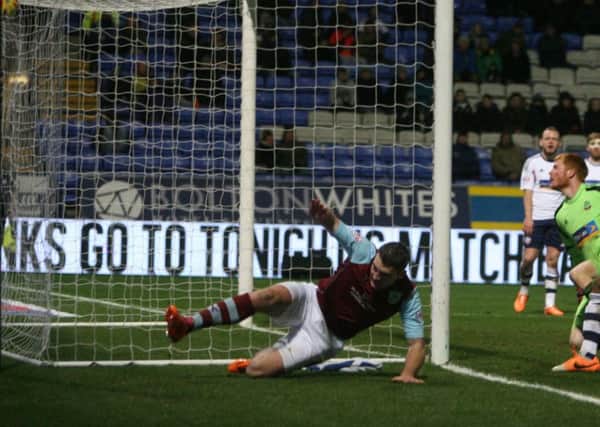 Sam Vokes slides in to put Burnley into the lead.