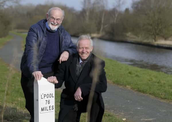 Unveiling of Lancashire's first restored mile post on the Leeds and Liverpool Canal in Burnley.  Pictured (right) is Bob Pointing from the Canal and River Trust with Mike Clarke (left) from the Leeds and Liverpool Canal Society.