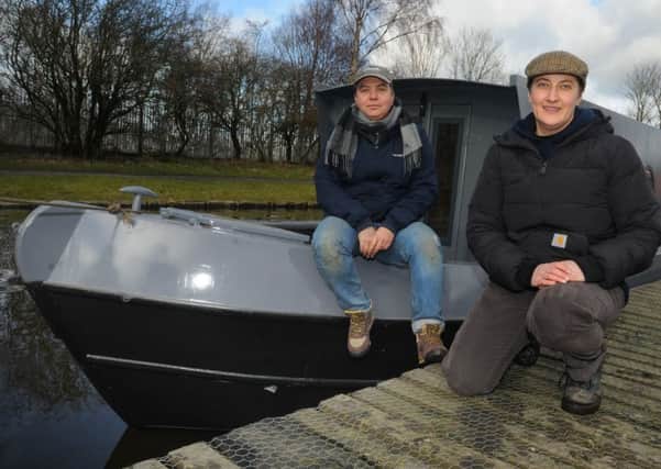 Artists in residence Cis O'Boyle and Rachel Anderson, right, with the canal boat, which will be a floating arts venue, Idle Women