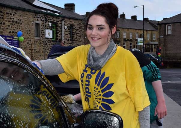Bobbie McCaigue and her friends helped raise Â£378 for Pendleside Hospice with a charity car wash at Colne Tyre Centre. (S)