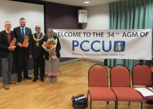 Simon Parker, from Emmaus House, Andrew Stephenson MP, Mayor of Pendle Coun. Nawaz Ahmed and his wife Mayoress Azmat Ahmed at the Pennine Community Credit Union AGM. (s)