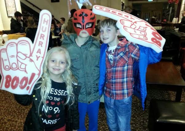 American Wrestling Show review at Burnley Mechanics.
Nine-year-old Dylan Parker (centre) his little sister Isobel (six) and best pal Robbie Dixon (nine) get ready to rumble at the American Wrestling Show at Burnley Mechanics Theatre.