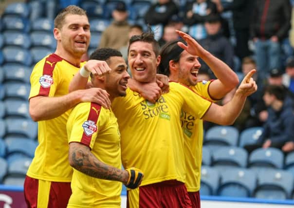 Stephen Ward, second right, celebrates putting the Clarets in front at Huddersfield